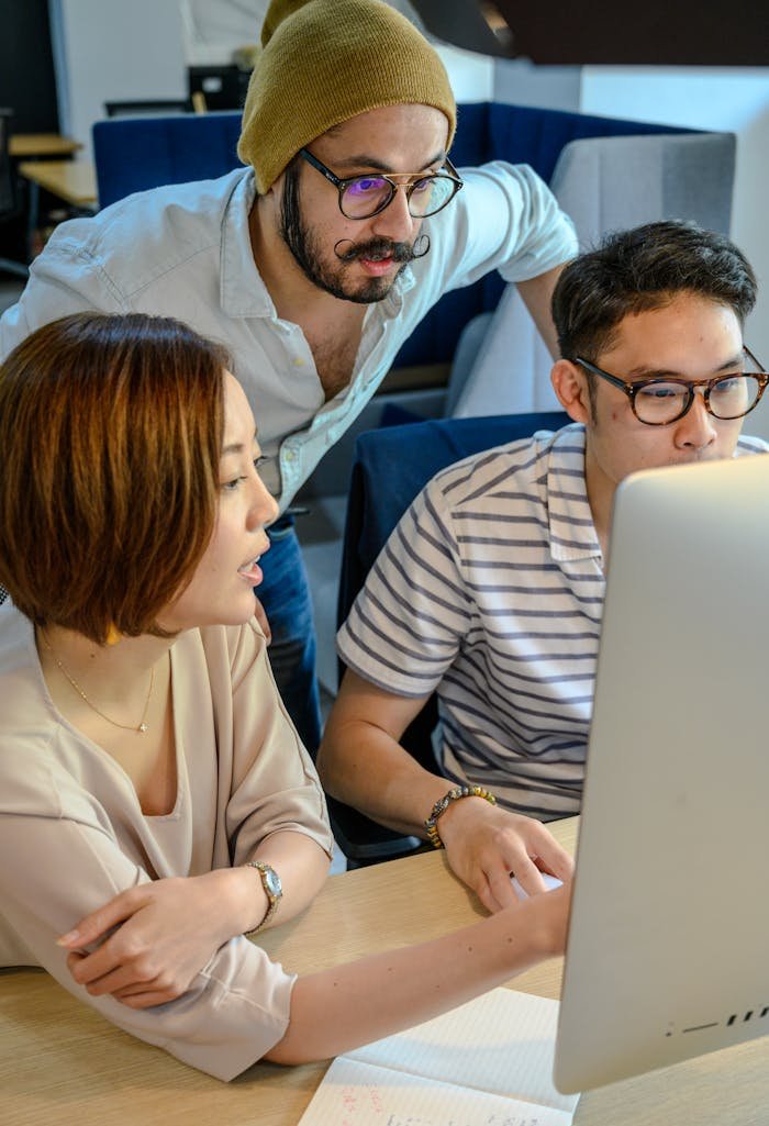 People in Front of a Computer Monitor 
